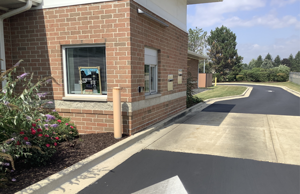 Photo of the outside of the Drive-up Window and return slots area of the building.