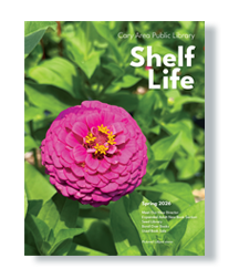 Front cover of the 2026 spring print newsletter. It is an up close shot of a bright pink zinnia amongst green leaf foliage.